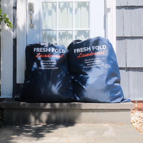 Fresh Fold laundry bags ready for pickup and delivery service
