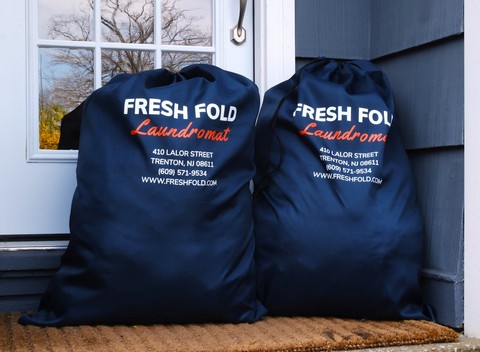 Fresh Fold laundry bags ready for pickup and delivery service
