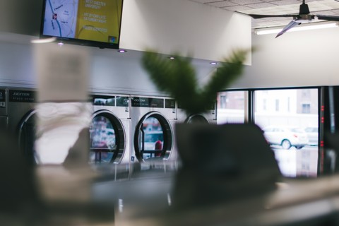 Dexter commercial dryers and modern interior at Fresh Fold Laundromat